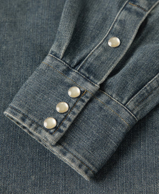 Blue slub denim western shirt sleeve cuff with button placket and pearl snaps