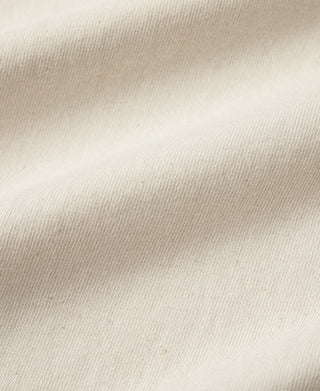 Apricot textured knit fabric close-up, tubular t-shirt material detail
