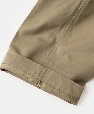 Khaki cotton twill trouser hem with stitched cuff and visible seam