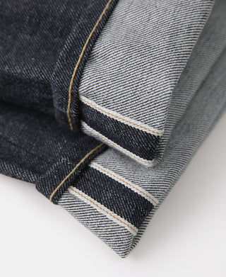 Selvedge denim jeans with contrast yellow stitching at hem and cuff