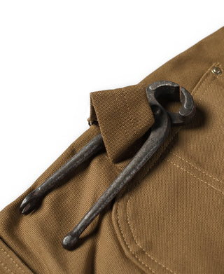 Brown canvas front with two metal tool holders and top button