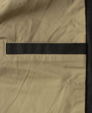 Olive bomber jacket sleeve cuff with contrast black band and stitched edge