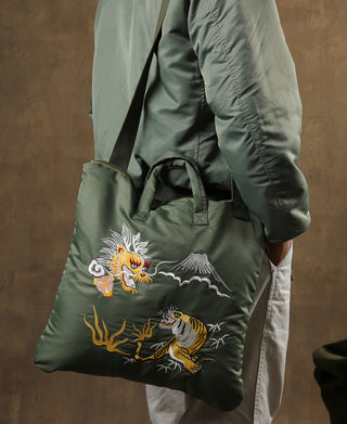 Olive embroidered tote bag with side handles and dragon/tiger patch artwork
