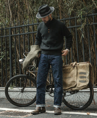 Black wool high-neck sweater with front buttons and long sleeves