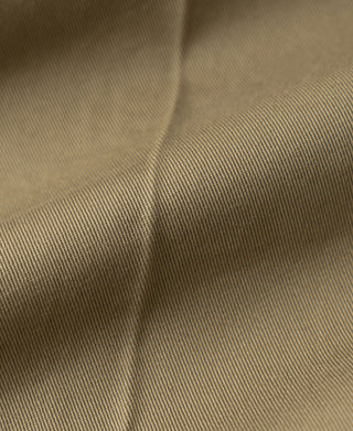 Khaki cotton twill fabric close-up with fine woven texture