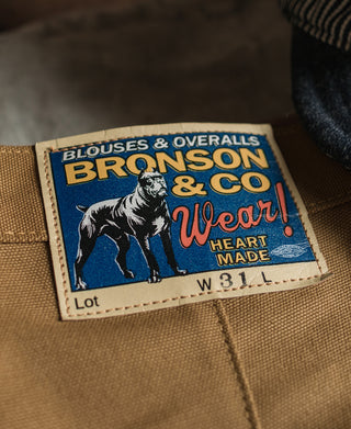 Bronson & Co. label inside brown canvas pants, size W31L