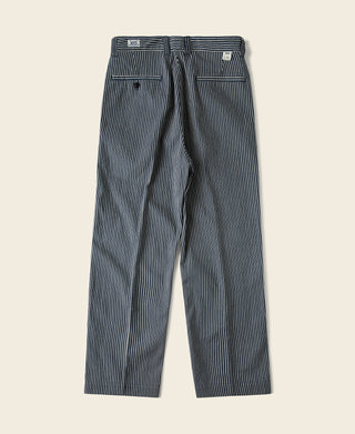 Blue and white striped work pants with button closure and back pockets.