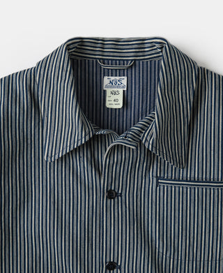 Striped cossack jacket collar and snap placket detail with size label inside
