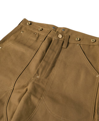 Brown canvas pant waist with belt loops, metal snap buttons, and pleated front