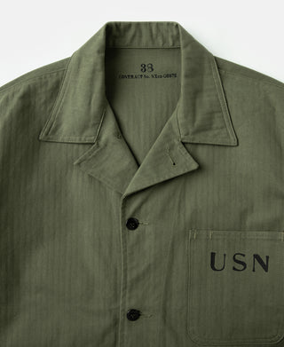 Olive utility jacket close-up of USN chest pocket and button placket