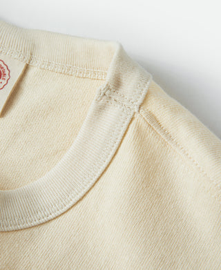 Apricot t-shirt crewneck with ribbed trim and front pocket edge