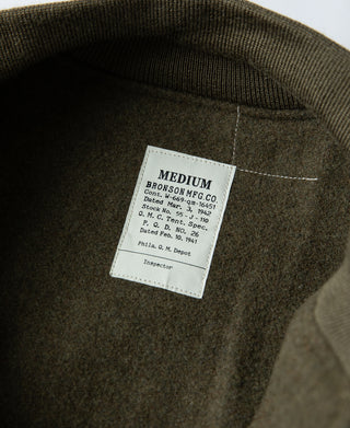 Yellow-green jacket interior with Medium size label on dark lining.