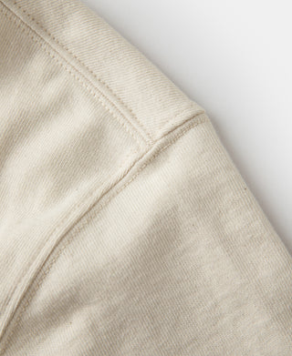 Apricot tubular athletic T-shirt close-up of seam and knit texture