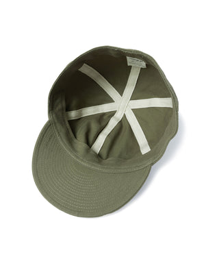 Olive A-3 flight cap interior with white cross strap detail