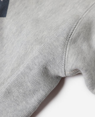 Gray crewneck sweatshirt sleeve cuff with stitched hem