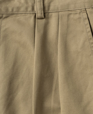 Khaki trousers with stitched pleats and waistband seam detail.