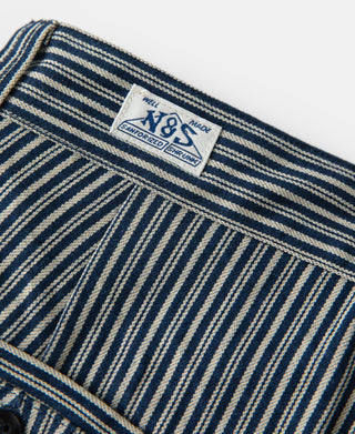 Striped work pants label patch on waistband with V&S text.