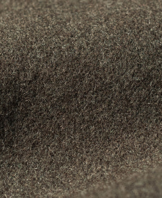 Close-up of the coat's textured brown wool fabric