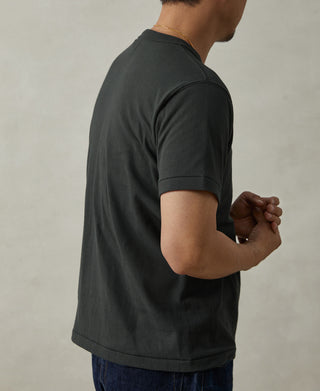 Vintage black athletic t-shirt with crew neck and short sleeves, side view