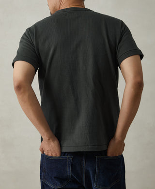 Vintage black athletic t-shirt with crew neck and short sleeves, back view