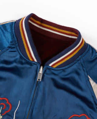 Blue reversible jacket with striped ribbed collar and metal zipper at front